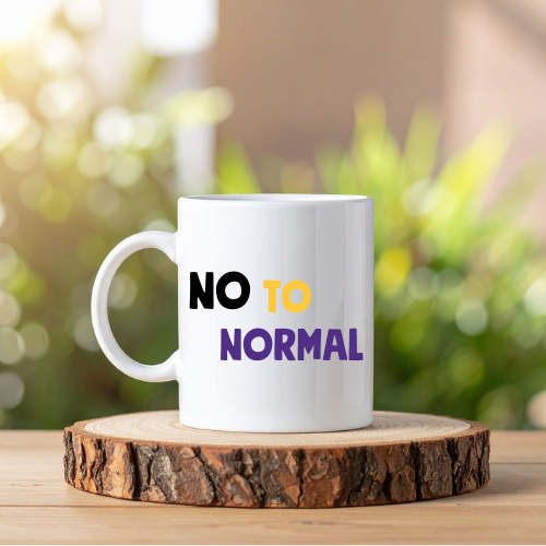 A white mug with NO TO NORMAL written in black, yellow and purple